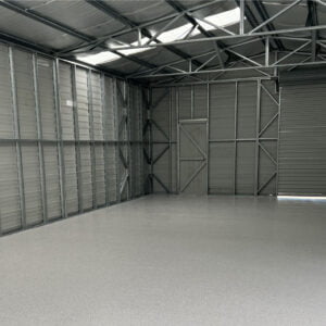 A large warehouse with a restored epoxy floor.