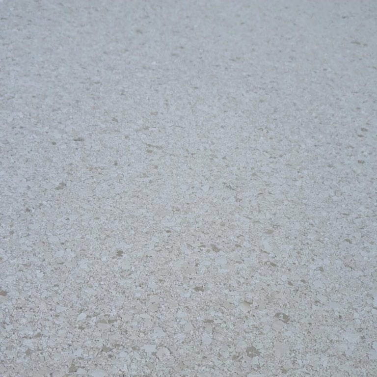 A close up view of a white concrete surface.
