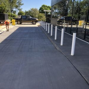 A restored parking lot with a car parked next to it.