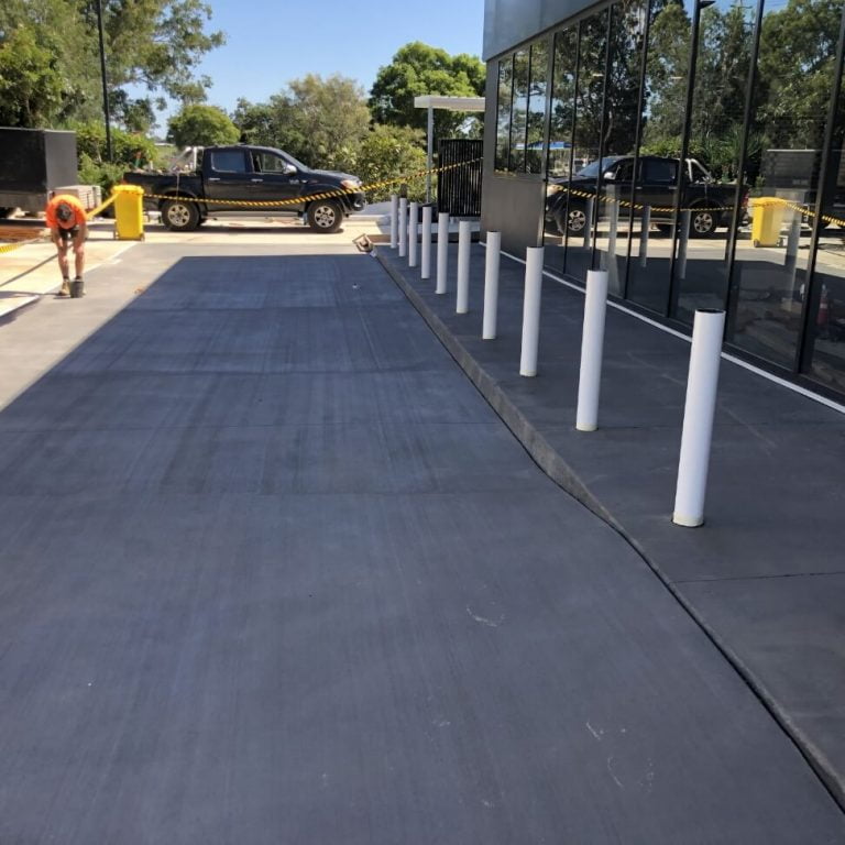 A restored parking lot with a car parked next to it.