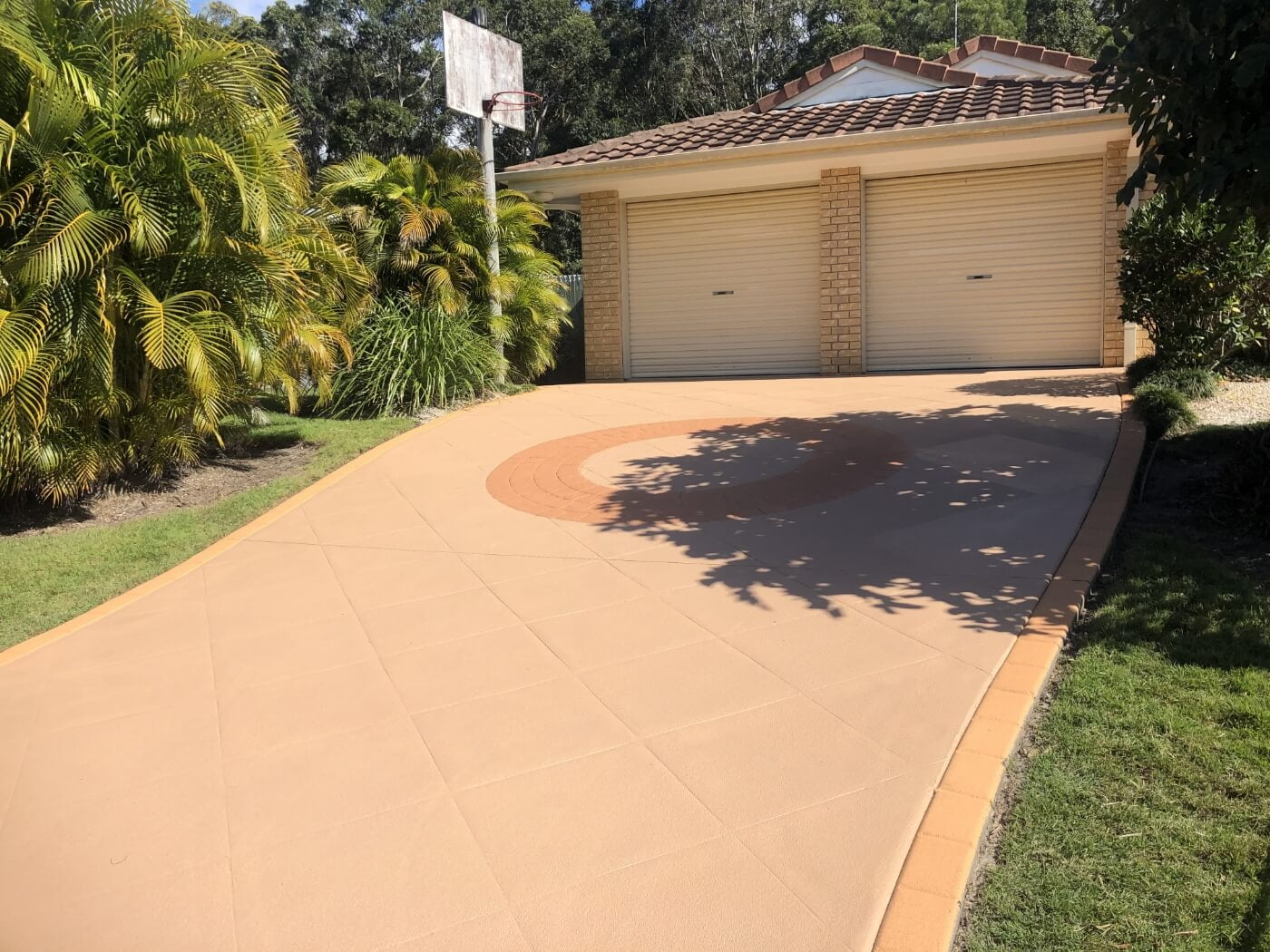 A driveway that has been painted with a tan color.