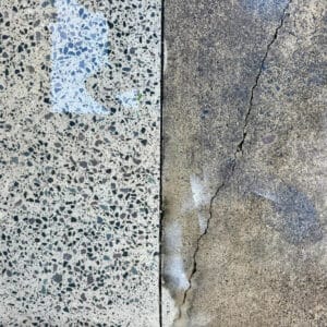 Close-up of two adjacent surfaces: on the left, a speckled terrazzo slab; on the right, a cracked, weathered concrete with discoloration.