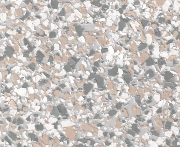 Close-up of a terrazzo floor with a pattern of scattered white, gray, and beige stone fragments.