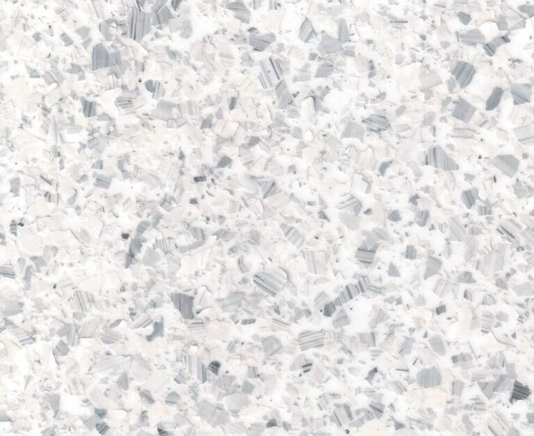 White and gray terrazzo pattern with irregular fragments scattered across the surface.